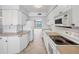 A bright white kitchen with view to the water at 5300 Gulf Dr # 501, Holmes Beach, FL 34217
