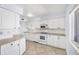 A bright white kitchen is complemented by tile floors and ample cabinet space for a clean, cohesive look at 5300 Gulf Dr # 501, Holmes Beach, FL 34217