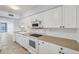 Bright kitchen with clean white appliances at 5300 Gulf Dr # 501, Holmes Beach, FL 34217