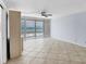 Bright and airy living space with tile flooring and expansive ocean views through large windows at 5300 Gulf Dr # 501, Holmes Beach, FL 34217