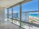 Enclosed sunroom with large windows providing stunning views of the beach and the neighborhood at 5300 Gulf Dr # 501, Holmes Beach, FL 34217