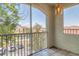Enclosed balcony with views of surrounding community and parking at 5552 Bentgrass Dr # 7-301, Sarasota, FL 34235
