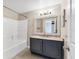 Bathroom with tub and shower combination, and marble sink at 5552 Bentgrass Dr # 7-301, Sarasota, FL 34235
