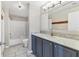 Bathroom featuring a vanity with marble countertop, and shower with a tub at 5552 Bentgrass Dr # 7-301, Sarasota, FL 34235
