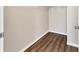 Walk-in closet with wood-look floors and ample storage space at 5552 Bentgrass Dr # 7-301, Sarasota, FL 34235