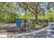 View of dog park featuring black chain link fence with a pet waste station at 5552 Bentgrass Dr # 7-301, Sarasota, FL 34235