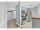 Modern kitchen with stainless steel appliances, wood floors and blue cabinets at 5552 Bentgrass Dr # 7-301, Sarasota, FL 34235