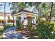 Exterior view of the mail center featuring a red tile roof and yellow trim at 5552 Bentgrass Dr # 7-301, Sarasota, FL 34235