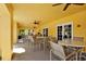 Outdoor patio offers multiple seating areas with chairs and tables, great for enjoying the weather at 5552 Bentgrass Dr # 7-301, Sarasota, FL 34235