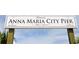Historic sign for Anna Maria City Pier, est. 1911, featuring a restaurant and bait shop at 5603 1St Avenue Dr Nw, Bradenton, FL 34209