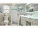 Modern bathroom features a glass-enclosed shower, stylish vanity, and a sleek design at 5603 1St Avenue Dr Nw, Bradenton, FL 34209