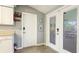 Pantry area with outdoor exit, inside exit, and door to storage area at 5603 1St Avenue Dr Nw, Bradenton, FL 34209