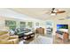 Cozy living room with a ceiling fan, comfortable seating, and access to the bedroom at 5603 1St Avenue Dr Nw, Bradenton, FL 34209