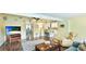 Bright living room with a seamless transition to the kitchen and dining areas, offering an inviting open space at 5603 1St Avenue Dr Nw, Bradenton, FL 34209