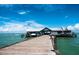 Charming pier stretching over the water, complete with benches and scenic views of the bay at 5603 1St Avenue Dr Nw, Bradenton, FL 34209