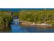 Scenic view of a wooden bridge spanning a waterway surrounded by lush greenery at 5603 1St Avenue Dr Nw, Bradenton, FL 34209