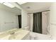 Bright bathroom featuring a shower-tub combo, vanity sink, and a well-lit mirror for a refreshing experience at 6030 7Th W Ave # 6030, Bradenton, FL 34209