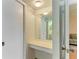Neutral vanity area featuring a big mirror with open access to the bathroom with a view of vanity at 6030 7Th W Ave # 6030, Bradenton, FL 34209