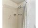 Bright tiled shower features dual shower heads and a grab bar for accessibility at 6030 7Th W Ave # 6030, Bradenton, FL 34209