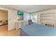 Bedroom featuring a dresser with television, a comfortable recliner, and hardwood flooring at 6030 7Th W Ave # 6030, Bradenton, FL 34209