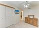 Bedroom with closet and TV; natural light filters through the window creating a welcoming space at 6030 7Th W Ave # 6030, Bradenton, FL 34209