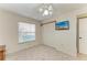 Cozy bedroom with closet and TV; natural light filters through the window creating a welcoming space at 6030 7Th W Ave # 6030, Bradenton, FL 34209