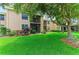 Well-maintained condo with lush landscaping, a covered patio and a large tree providing shade at 6030 7Th W Ave # 6030, Bradenton, FL 34209