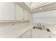 Clean kitchen with bright countertops, modern appliances, and plentiful cabinet storage at 6030 7Th W Ave # 6030, Bradenton, FL 34209