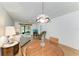 Cozy living room featuring wood-look floors and comfortable seating arrangement at 6030 7Th W Ave # 6030, Bradenton, FL 34209