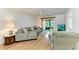 Comfortable living area with patio access and cozy seating arrangement at 6030 7Th W Ave # 6030, Bradenton, FL 34209