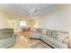 Living room features hardwood flooring, an open concept, and a large grey sofa at 6030 7Th W Ave # 6030, Bradenton, FL 34209