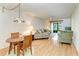 Bright living room with wood floors and sliding doors to a screened patio at 6030 7Th W Ave # 6030, Bradenton, FL 34209