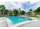 Inviting community pool featuring clear blue water, lounge chairs and beautiful landscaping at 6030 7Th W Ave # 6030, Bradenton, FL 34209