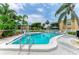 Beautiful outdoor pool with lush landscaping and seating creating a relaxing resort-like atmosphere at 6030 7Th W Ave # 6030, Bradenton, FL 34209