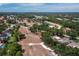 Aerial view showcasing the community, golf course, lakes, and lush landscaping that surround the property at 6110 Country Club Way # 102, Sarasota, FL 34243