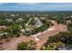 An aerial view of the community showcases the lush landscaping, golf course, and serene atmosphere of the property at 6110 Country Club Way # 102, Sarasota, FL 34243