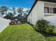 Well-maintained backyard featuring a screened-in pool and lush green grass at 6110 Country Club Way # 102, Sarasota, FL 34243