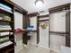 Organized walk-in closet with shelving and ample storage space at 6110 Country Club Way # 102, Sarasota, FL 34243