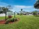 Welcome to The Hollows, a community of lovely townhomes surrounded by lush landscaping and mature trees at 6110 Country Club Way # 102, Sarasota, FL 34243