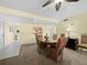 Cozy dining area features an oval table and a view to the kitchen at 6110 Country Club Way # 102, Sarasota, FL 34243