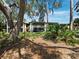Building exterior with lush green lawn at 6110 Country Club Way # 102, Sarasota, FL 34243