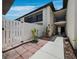 Well-maintained townhome featuring a private fenced patio, and lush landscaping and mature trees at 6110 Country Club Way # 102, Sarasota, FL 34243