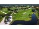 Scenic golf course view featuring lush green fairways, mature trees, tranquil water features, and challenging sand traps at 6110 Country Club Way # 102, Sarasota, FL 34243
