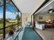 Relax on the covered lanai with screened enclosure, offering serene views of the yard at 6110 Country Club Way # 102, Sarasota, FL 34243