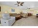 Open-concept living area with comfortable seating and natural light; ideal for relaxation and entertaining at 6110 Country Club Way # 102, Sarasota, FL 34243