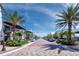 Picturesque street showcasing well-manicured landscaping, sidewalks, and architectural charm in a vibrant community at 6110 Country Club Way # 102, Sarasota, FL 34243