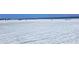 Wide, sandy beach with scattered umbrellas and beachgoers, showing a popular spot for relaxation and recreation at 6150 Midnight Pass Rd # V4, Sarasota, FL 34242