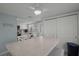 Dining area featuring seating for four, with adjacent kitchen and ample storage at 6150 Midnight Pass Rd # V4, Sarasota, FL 34242
