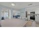 Bright dining area with a view into a cozy living room and a modern kitchen at 6150 Midnight Pass Rd # V4, Sarasota, FL 34242