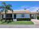 Charming one-story home with a well-manicured lawn and a covered carport, perfect for relaxed living at 6150 Midnight Pass Rd # V4, Sarasota, FL 34242
